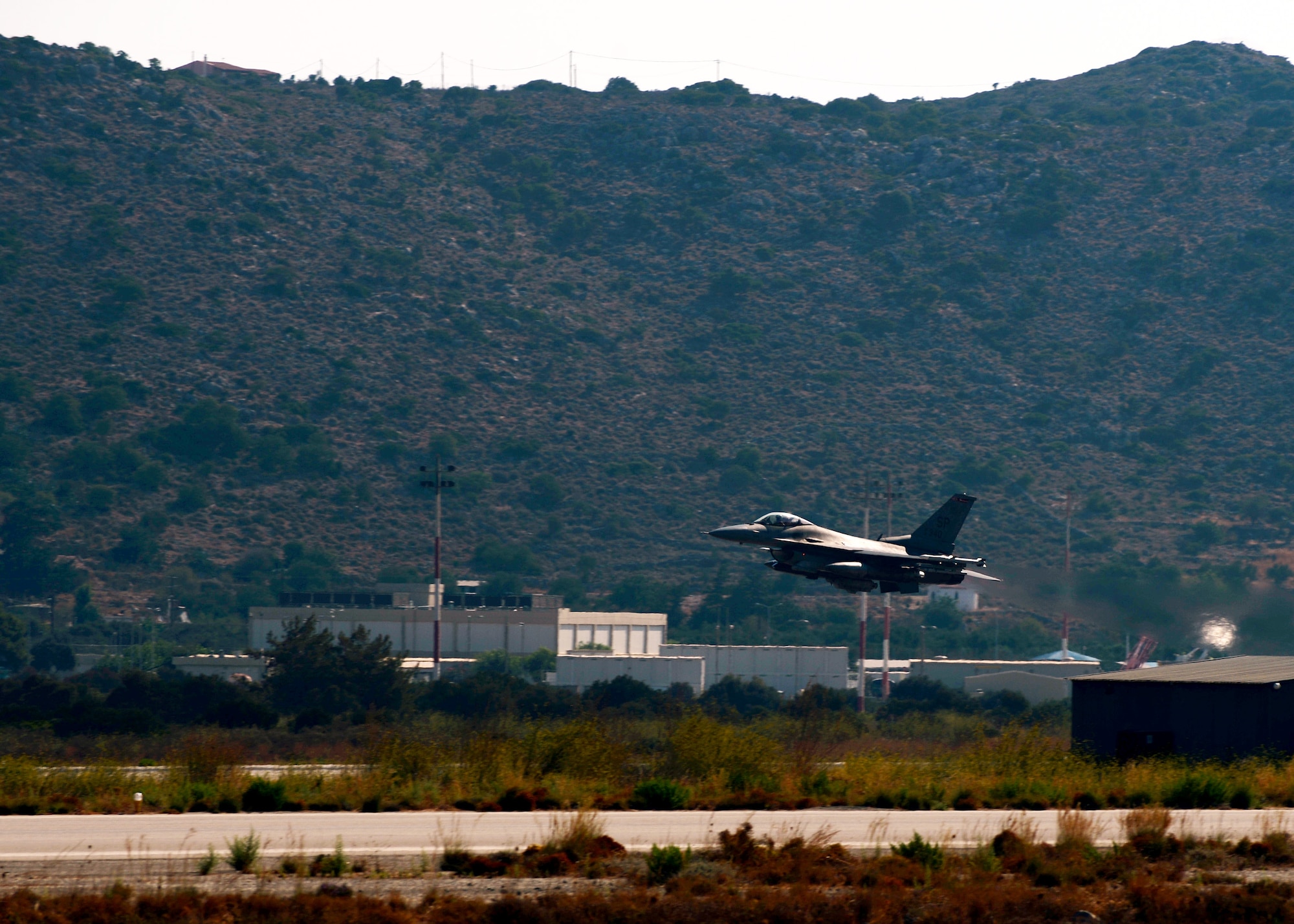 A U.S. Air Force F-16 Fighting Falcon fighter aircraft pilot takes off Aug. 12, 2014, from the flightline at Souda Bay, Greece, during a two-week training event with the Hellenic air force. The two nations partnered to enhance their breadth of air dominance. (U.S. Air Force photo by Staff Sgt. Daryl Knee/Released)