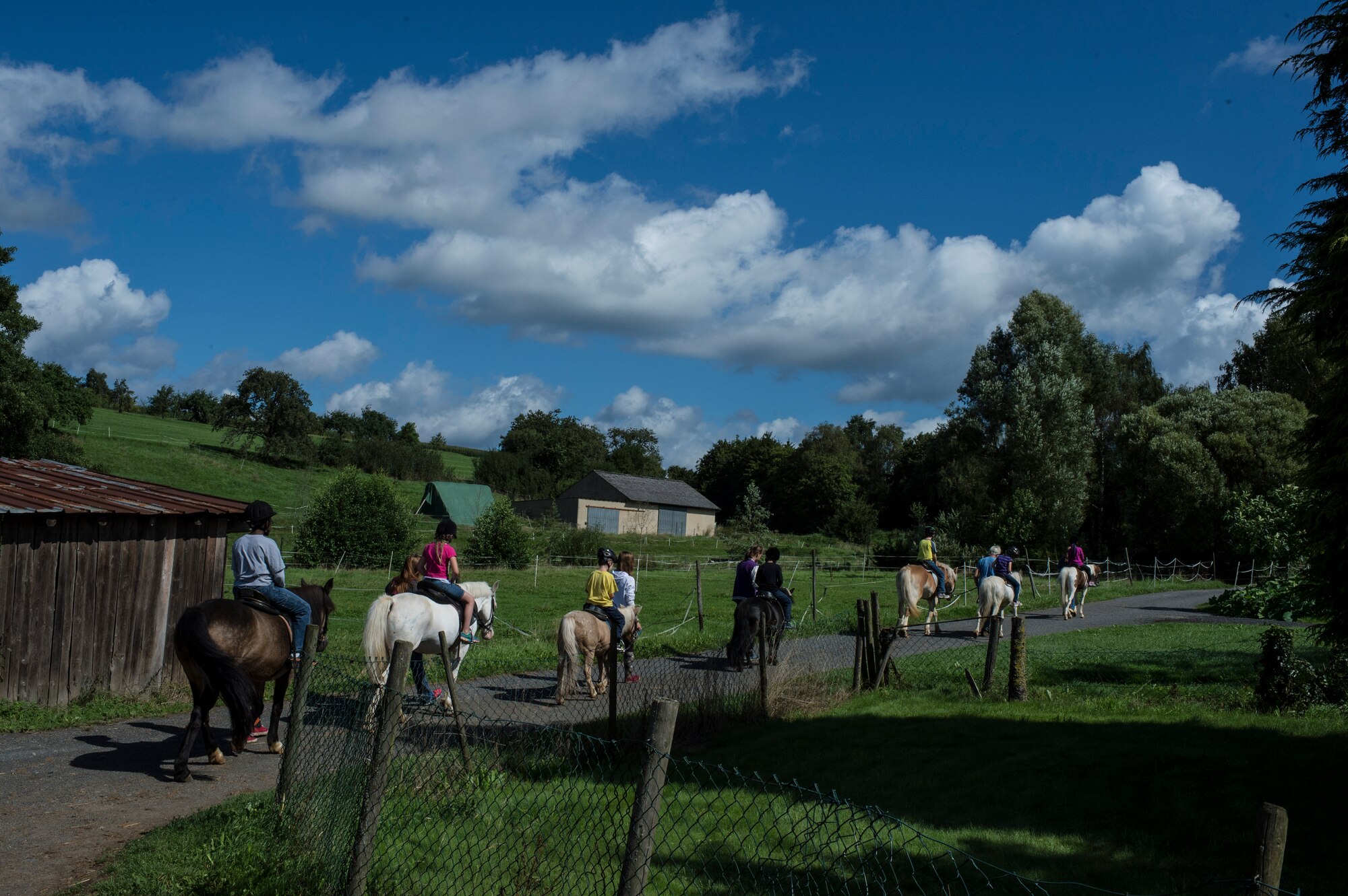 Children in the Exceptional Family Member Program camp go for a horseback ride at Spangdahlem, Germany, Aug. 12, 2014. EFMP provides a variety of resources and supported activities for special needs families. (U.S. Air Force photo by Staff Sgt. Christopher Ruano/Released)
