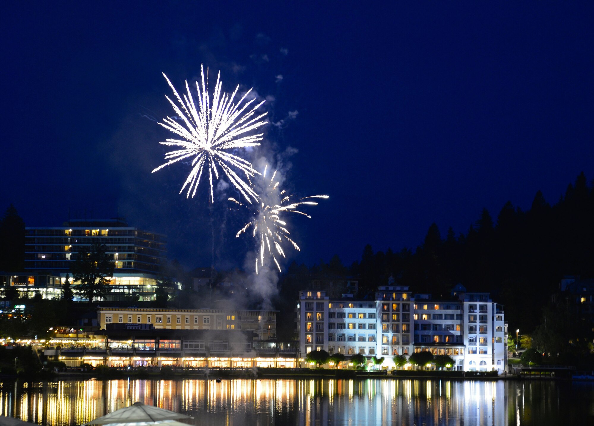 Fireworks light up the sky, July 5, 2014, at Lake Bled, Slovenia. During the summer, the lake is visited by tourists from all around for its warm weather and refreshing water temperature; while in the winter, the lake is frozen over and skiers enjoy the three ski areas: Kobla, Vogel and Krvavec. (U.S. Air Force photo/Capt. Lacie Collins)