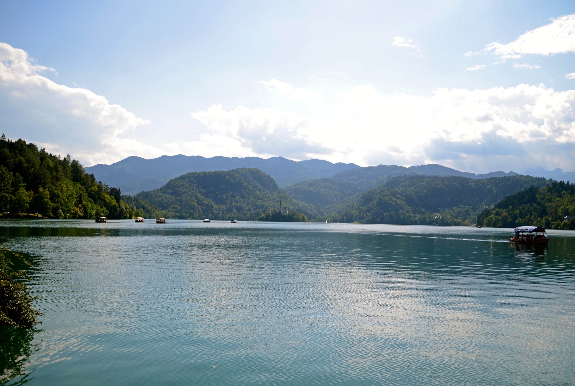 A Pletna boat travels to the Church of Assumption, July 5, 2014, at Lake Bled, Slovenia. Lake Bled is found approximately 40 minutes outside Slovenia’s capital, Ljubljana and an approximately three hour drive from Aviano. (U.S. Air Force photo/Capt. Lacie Collins)