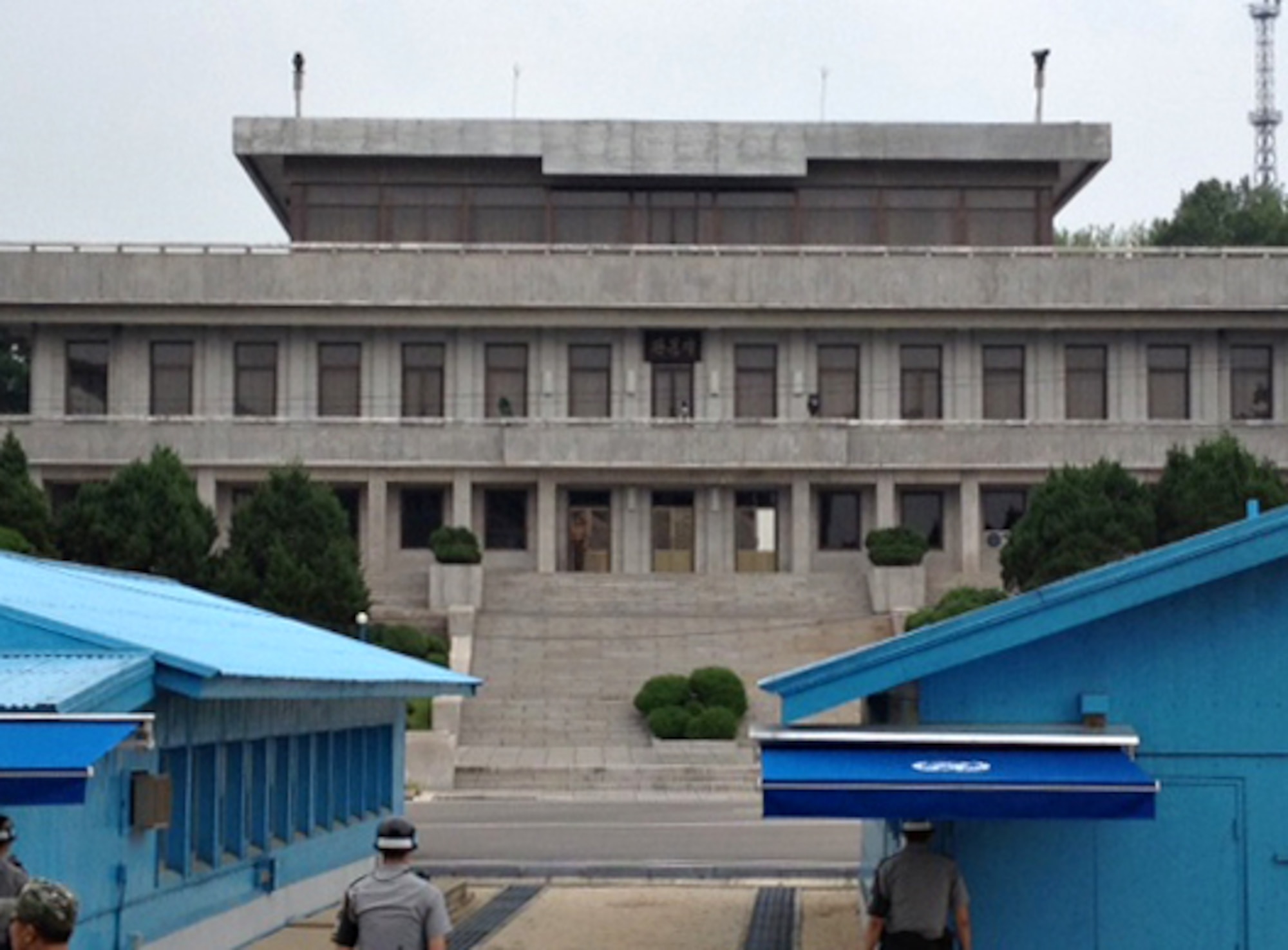 Members of the Republic of Korea and Democratic People’s Republic of Korea militaries maintain sight of one another in the Joint Security Area near the Demilitarized Zone on the Korean peninsula, Aug. 13, 2014. Visitors may also view the inside of the Military Armistice Committee building where meetings between the two Koreas are held. (U.S. Air Force photo/Airman 1st Class Ashley J. Thum)
