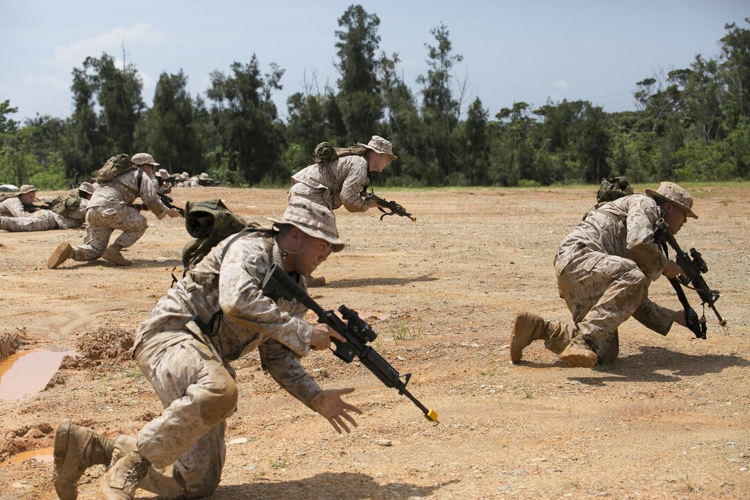 Corpsmen train for small-unit rushes as part of force resuscitative care training, June 27, 2014 at Camp Hansen, Okinawa, Japan. The training involved simulated combat casualty scenarios that prepared the corpsmen for triaging and treating potential casualties during combat deployments. The corpsmen are with Company B, 3rd Medical Battalion, 3rd Marine Logistics Group, III Marine Expeditionary Force.