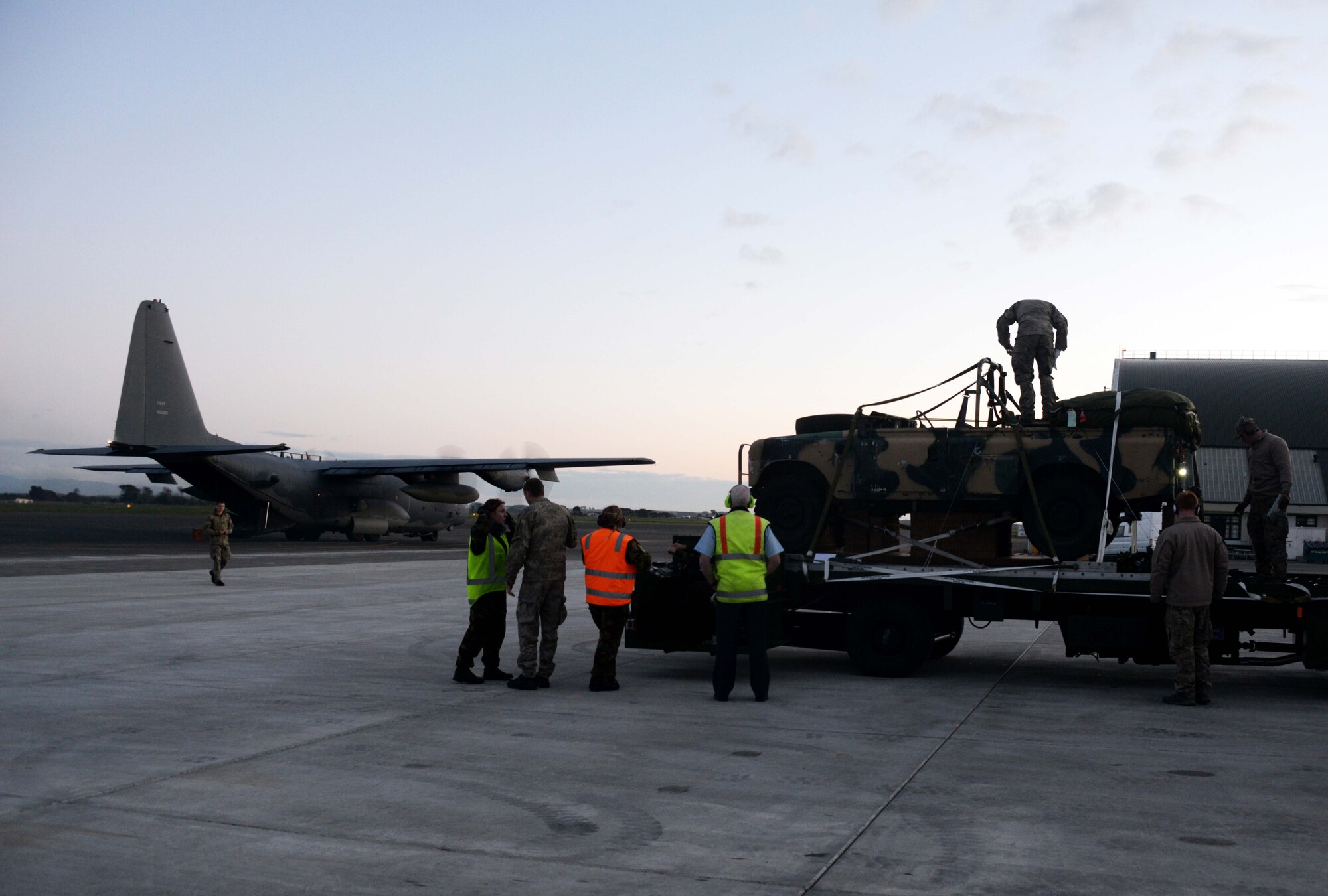 Members from the U.S. Air Force and the New Zealand Defense Force prepare to load heavy equipment for an air drop July 26, 2014 at Ohakea Air Base, New Zealand.  Members from the 353rd Special Operations Group participated in Exercise Balance Net July 17 through July 31 in Whenuapai, New Zealand. During the exercise, members from both the New Zealand Defense Force and U.S. Air Forces worked together to conduct personnel and equipment air drops while exchanging new techniques. This was the first time in almost three decades the group has deployed to New Zealand.  (U.S. Air Force photo by Tech. Sgt. Kristine Dreyer)