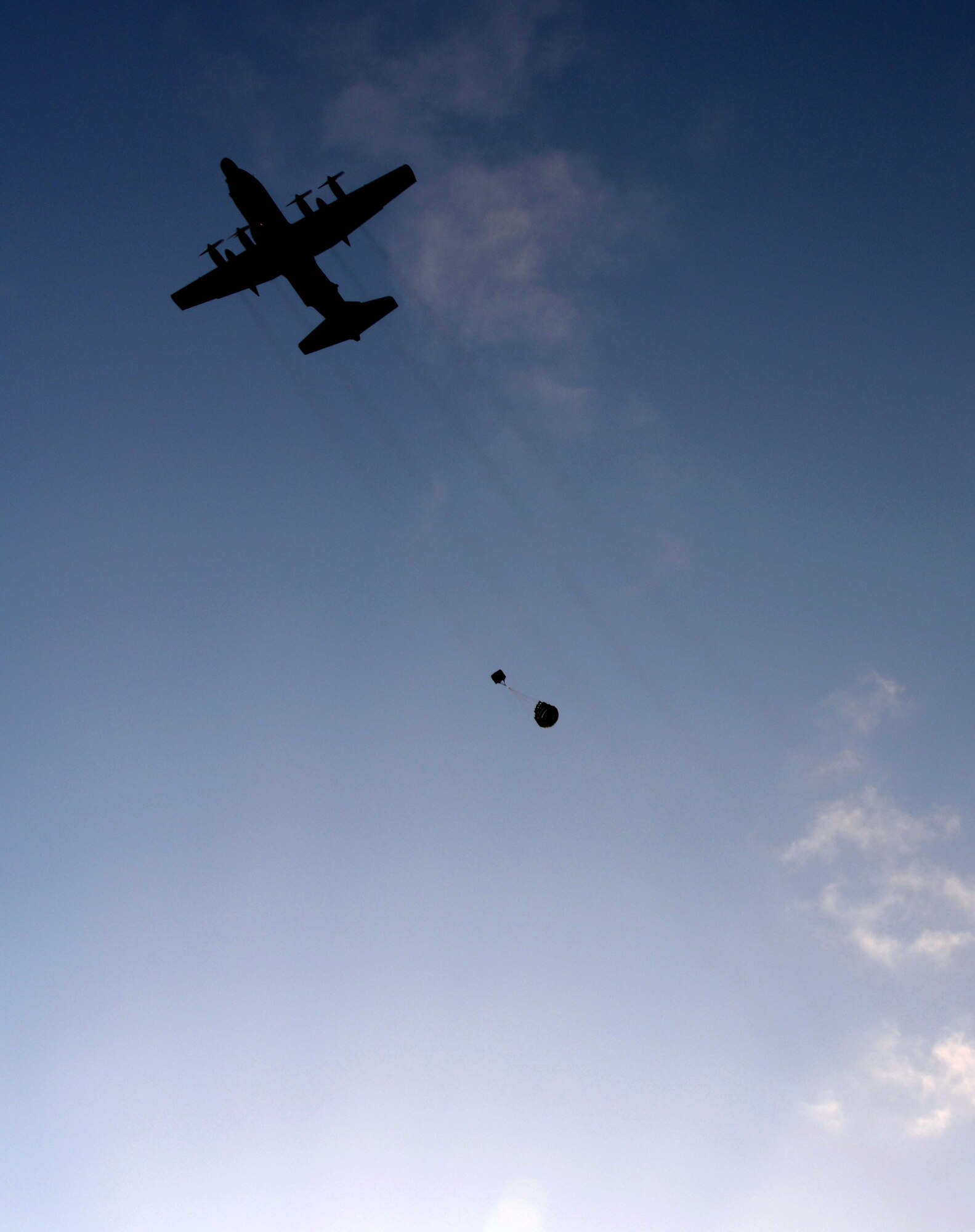 A crew from the 1st Special Operations Squadron conducts air drops over a drop zone in New Zealand July 27, 2014 during Exercise Balance Net.  During the exercise, members from both the New Zealand Defense Force and U.S. Air Forces worked together to conduct personnel and equipment air drops while exchanging new techniques. This was the first time in almost three decades the group has deployed to New Zealand.  (U.S. Air Force photo by Tech. Sgt. Kristine Dreyer)