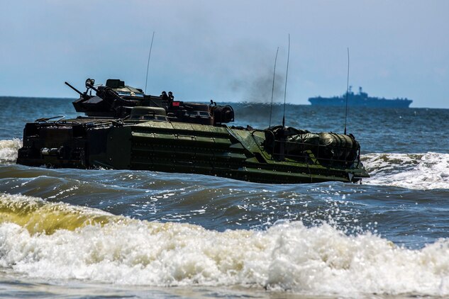 An amphibious assault vehicle with the 24th Marine Expeditionary Unit’s Ground Combat Element, Battalion Landing Team 3rd Battalion, 6th Marine Regiment, approaches Onslow Beach, N.C., during a tactical offload, August 12, 2014. The offload was part of Amphibious Squadron/Marine Expeditionary Unit Integration, the second major exercise for the 24th MEU. AAV’s were launched from the Iwo Jima Amphibious Ready Group’s USS Fort McHenry. (U.S. Marine Corps photo by Cpl. Mary M. Carmona)