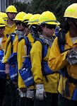 California Army National Guard Soldiers, including Spc. Eunjin Lee, with Fire Crew 10 head back into camp after working all day as hand crews at the Little Deer fire in Klamath National Forest Aug. 10, 2014, in support of the California Department of Forestry and Fire Protection's firefighting efforts. 