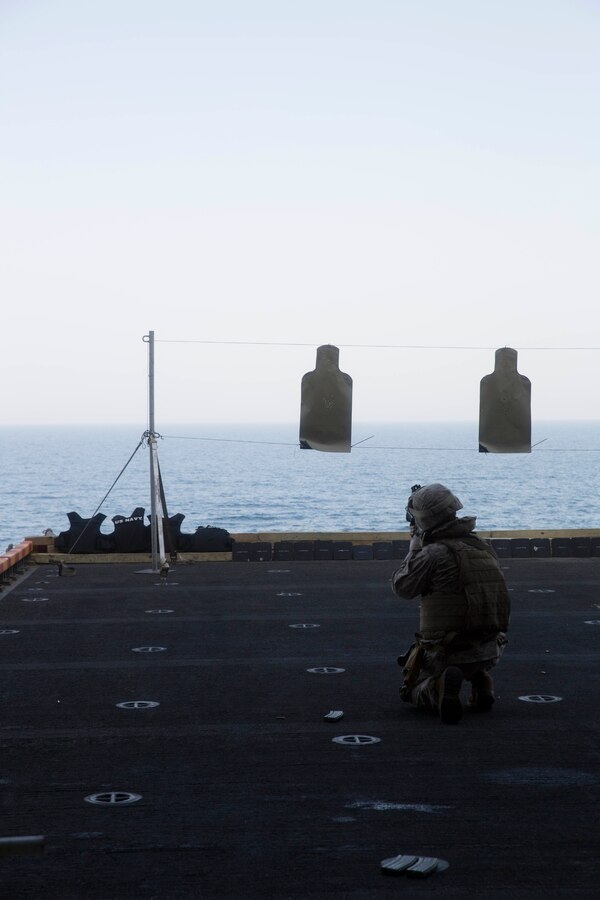 U.S. 5TH FLEET AREA OF RESPONSIBILITY (July 30, 2014) A U.S. Marine with low altitude air defense section, Marine Medium Tiltrotor Squadron (VMM) 263 (Reinforced), 22nd Marine Expeditionary Unit (MEU), sights in on his target from the kneeling position during a live-fire range aboard the multi-purpose amphibious assault ship USS Bataan (LHD 5). The 22nd MEU is deployed with the Bataan Amphibious Ready Group as a theater reserve and crisis response force throughout the U.S. Central Command and the U.S. 5th Fleet area of responsibility. (U.S. Marine Corps photo by Sgt. Alisa J. Helin/Released)