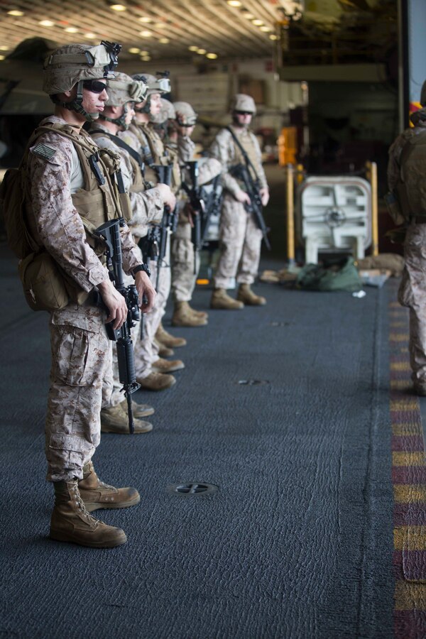 U.S. 5TH FLEET AREA OF RESPONSIBILITY (July 30, 2014) U.S. Marines with low altitude air defense section, Marine Medium Tiltrotor Squadron (VMM) 263 (Reinforced), 22nd Marine Expeditionary Unit (MEU), wait to move to the firing line during a live-fire range aboard the amphibious assault ship USS Bataan (LHD 5). The 22nd MEU is deployed with the Bataan Amphibious Ready Group as a theater reserve and crisis response force throughout the U.S. Central Command and the U.S. 5th Fleet area of responsibility. (U.S. Marine Corps photo by Sgt. Alisa J. Helin/Released)