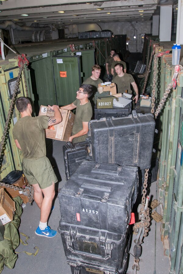 U.S. 5TH FLEET AREA OF RESPONSIBILITY (July 30, 2014) U.S. Marines with Combat Logistics Battalion 22, 22nd Marine Expeditionary Unit (MEU), clean cargo containers in preparation for a U.S. Customs and Boarder Protection inspection aboard the amphibious transport dock ship USS Mesa Verde (LPD 19). The 22nd MEU is deployed with the Bataan Amphibious Ready Group as a theater reserve and crisis response force throughout U.S. Central Command and the U.S. 5th Fleet area of responsibility. (U.S. Marine Corps photo by Cpl. Manuel A. Estrada/Released)