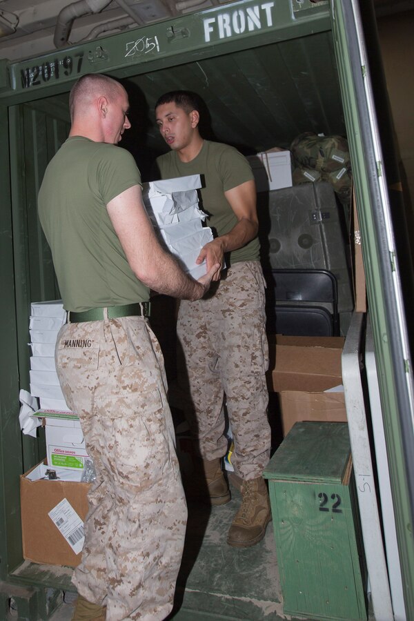 U.S. 5TH FLEET AREA OF RESPONSIBILITY (July 30, 2014) U.S. Marine Corps Cpl. Andrew Manning, left, Combat Logistics Battalion (CLB) 22, 22nd Marine Expeditionary Unit (MEU), administration noncommissioned officer in charge and native of Kinston, N.C., and Lance Cpl. Estevan Romero, CLB-22 administration specialist and native of Tucson, Ariz., clean a cargo container in preparation for a U.S. Customs and Boarder Protection inspection aboard the amphibious transport dock ship USS Mesa Verde (LPD 19). The 22nd MEU is deployed with the Bataan Amphibious Ready Group as a theater reserve and crisis response force throughout U.S. Central Command and the U.S. 5th Fleet area of responsibility. (U.S. Marine Corps photo by Cpl. Manuel A. Estrada/Released)
