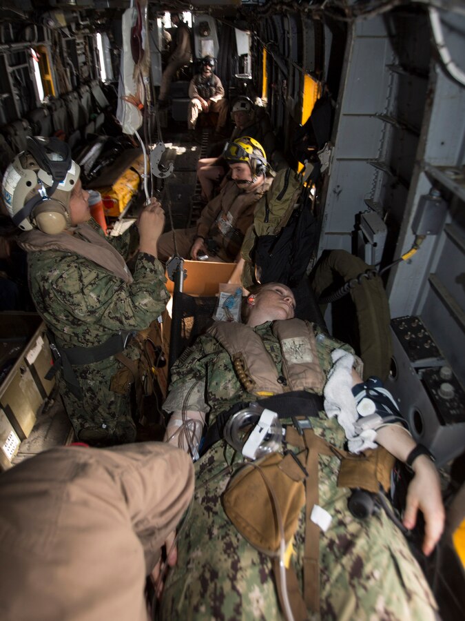 U.S. 5TH FLEET AREA OF RESPONSIBILITY (Aug. 4, 2014) U.S. Navy medical personnel with Expeditionary Resuscitative Surgical System (ERSS) Team 12 and Marine Medium Tiltrotor Squadron (VMM) 263 (Reinforced), 22nd Marine Expeditionary Unit (MEU), treat a simulated patient aboard a CH-53E Super Stallion during a tactical evacuation drill. The 22nd MEU is deployed with the Bataan Amphibious Ready Group as a theater reserve and crisis response force throughout U.S. Central Command and the U.S. 5th Fleet area of responsibility. (U.S. Marine Corps photo by Cpl. Manuel A. Estrada/Released)