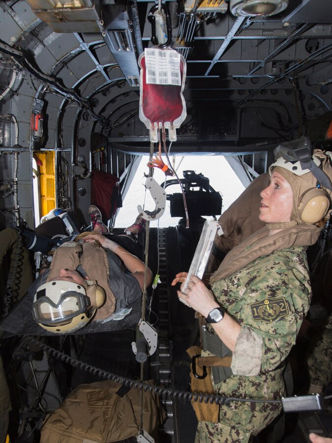 U.S. 5TH FLEET AREA OF RESPONSIBILITY (Aug. 4, 2014) U.S. Navy Lt. J.G. Kirra Tobias, Expeditionary Resuscitative Surgical System (ERSS) Team 12 critical care nurse, treats a simulated patient aboard a CH-53E Super Stallion with Marine Medium Tiltrotor Squadron (VMM) 263 (Reinforced), 22nd Marine Expeditionary Unit (MEU) during a tactical evacuation drill. The 22nd MEU is deployed with the Bataan Amphibious Ready Group as a theater reserve and crisis response force throughout U.S. Central Command and the U.S. 5th Fleet area of responsibility. (U.S. Marine Corps photo by Cpl. Manuel A. Estrada/Released)