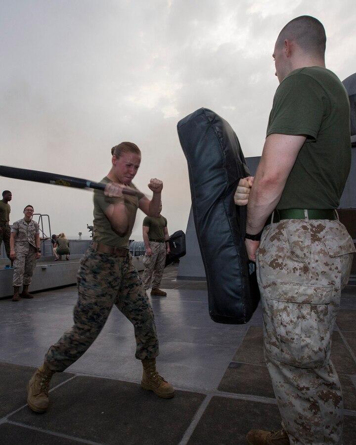 U.S. 5TH FLEET AREA OF RESPONSIBILITY (Aug. 6, 2014) U.S. Marine Corps Cpl. Sarah Steiert, left, Combat Logistics Battalion 22, 22nd Marine Expeditionary Unit (MEU), motor transportation operator and native of Desoto, Texas, defends herself from a simulated attacker, after being sprayed with oleoresin capsicum (OC) spray, also known as pepper spray, part of an OC spray course aboard the amphibious transport dock ship USS Mesa Verde (LPD 19). The 22nd MEU is deployed with the Bataan Amphibious Ready Group as a theater reserve and crisis response force throughout U.S. Central Command and the U.S. 5th Fleet area of responsibility. (U.S. Marine Corps photo by Cpl. Manuel A. Estrada/Released)