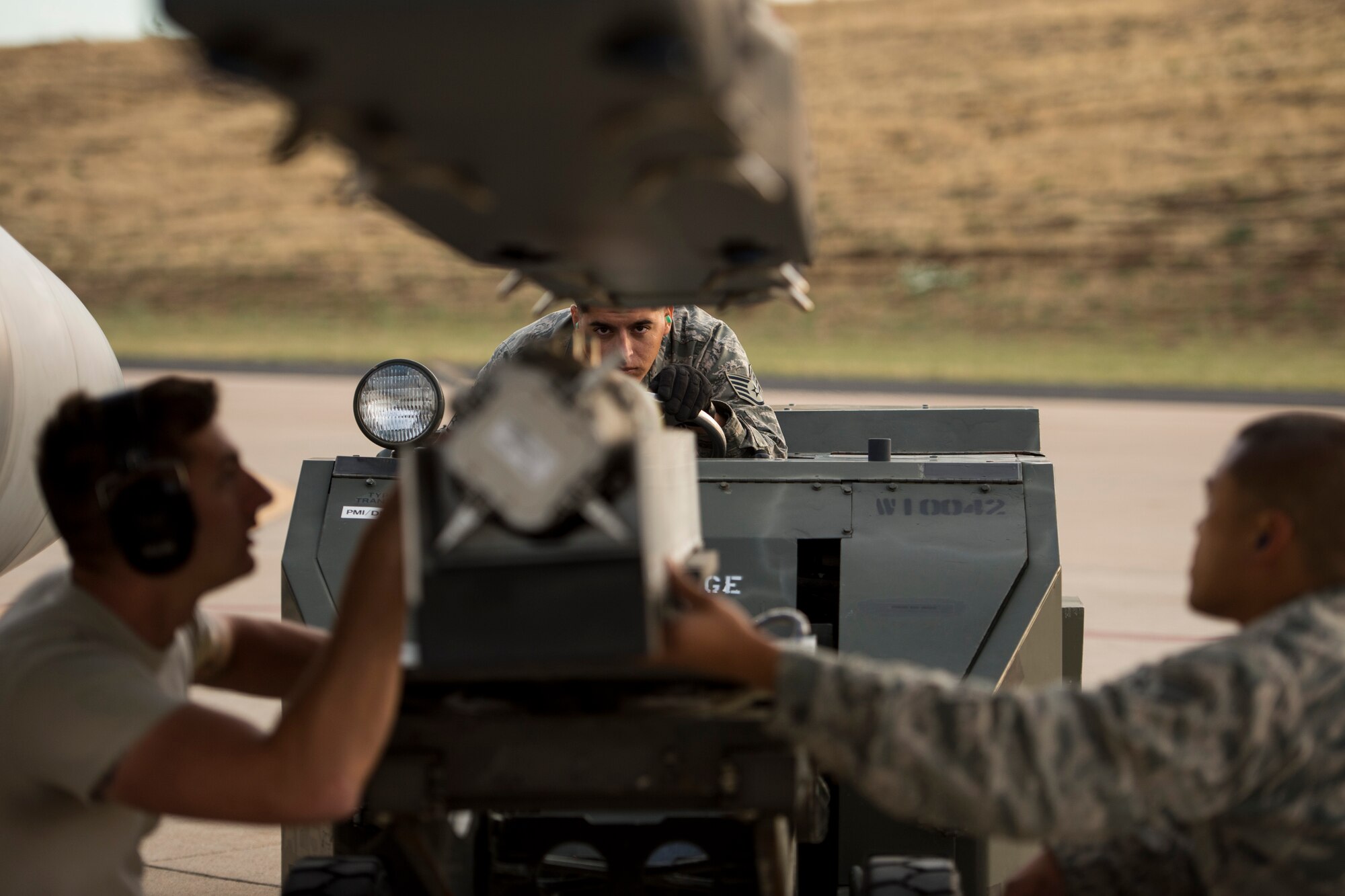Senior Airman Jason Nonog prepares an F-16 Fighting Falcon for takeoff Aug. 13, 2014, during an air-to-ground exercise at Hill Air Force Base, Utah. The Weapons System Evaluation Program is an annual training exercise where the effectiveness, maintainability, suitability and accuracy of guided munitions are evaluated. The 510th Fighter Squadron from Aviano Air Base, Italy, and the 494th FS from Royal Air Force Lakenheath, England, joined the 388th Fighter Wing at Hill AFB, for the exercise. (U.S. Air Force photo/Airman 1st Class Taylor Queen)
