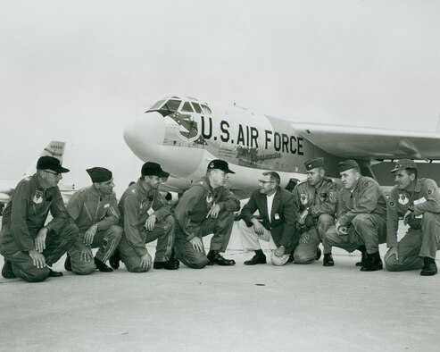 Base leadership and former North Dakota governor, William Guy, kneel in front of the "Peace Persuader" on Minot Air Force Base in July of 1961. This was the first B-52H Stratofortress delivered to the base. -- (Courtesy Photo)