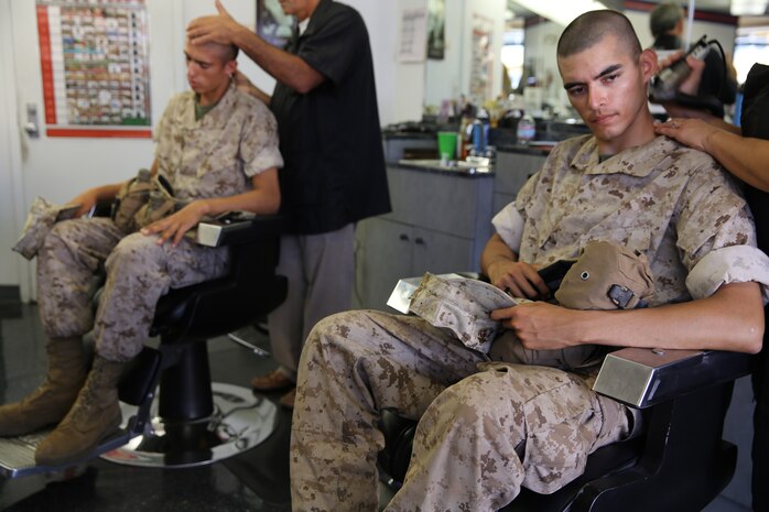 Recruits of Alpha Company, 1st Recruit Training Battalion, receive haircuts at Marine Corps Recruit Depot San Diego recruit barber shop, Aug. 7. After the recruits finished getting their haircuts, they continued with the day’s training.