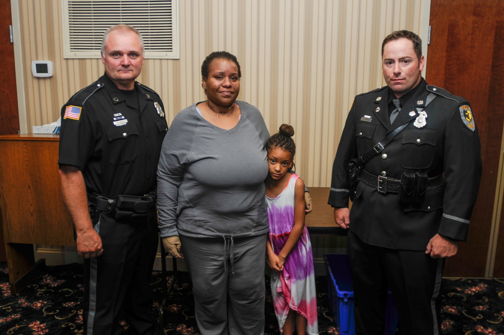 Two Maryland Army National Guard Soldiers, Sgt. Maj. Merle L. Bragg Jr. with the 29th infantry division, and Sgt. Edward L. Carmean with the 290th military police company, both senior police officers with the Berlin Police Department, were presented with the Life Saving Award, Aug. 11, 2014, at the Council Chambers - Berlin Town Hall in Berlin, Md. Bragg and Carmean heroically rescued a 6-year-old girl, Mia McKenize, from a residential house fire on April 17, 2014, at 117 Branch Street. 