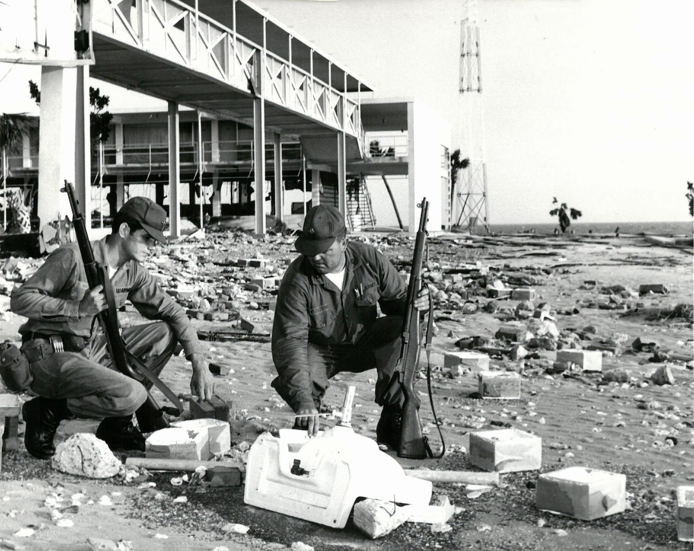 Amid the rubble at Biloxi on Aug. 18, 1969, were Spc. 4 Robert Vaughn and  Sgt. 1st Class Rodney Ferguson, 135th Transportation Company (Amphibious), Mississippi Army  National Guard, based at Ocean Springs, Mississippi.  Photo courtesy of National Guard Educational Foundation.