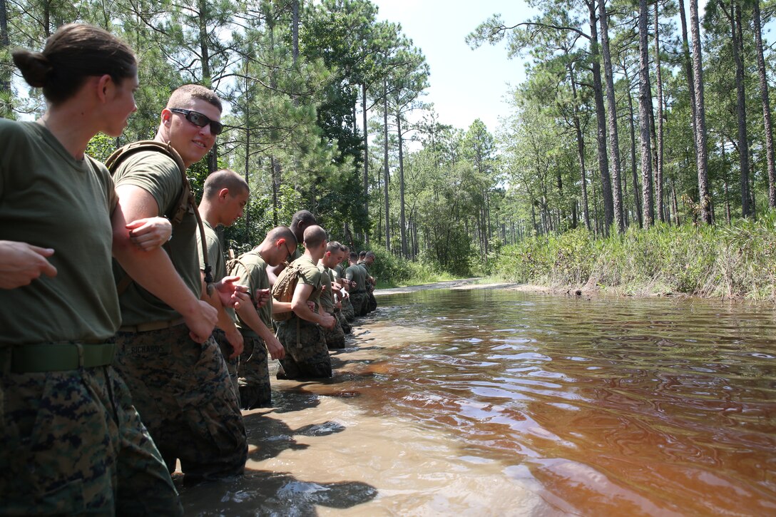 Marines with Motor Transportation Services Company, Combat Logistics Battalion 25 practice searching a water-fording navigation course at Camp Lejeune, North Carolina Aug. 13, 2014, during exercise Heavy Metal 14.Before the Marines entered the water, they were given a class on fording techniques and procedures, which explained the importance of knowing what is underwater. The Marines crossing are required to know if there are drop-offs concealed below the surface that could cause a vehicle to become inoperable.