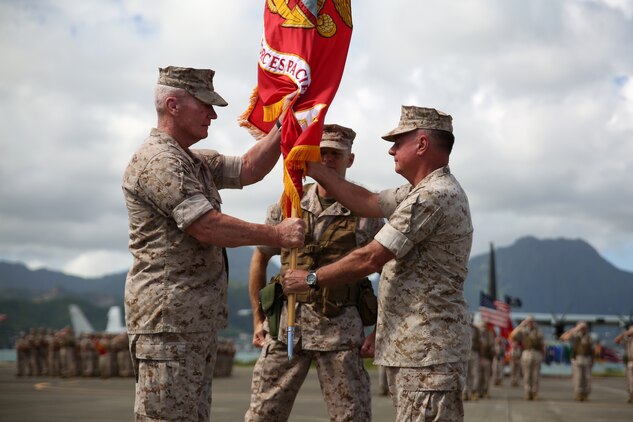 140815-M-LV138-465 MARINE CORPS BASE HAWAII – Lt. Gen. John A. Toolan, receives the U.S. Marine Corps Forces, Pacific colors from Lt. Gen. Terry Robling, symbolizing the transfer of command of MARFORPAC, during the Change of Command Ceremony Aug. 15, aboard Marine Corps Base Hawaii. (U.S. Marine Corps photo by Sgt. Sarah Dietz)