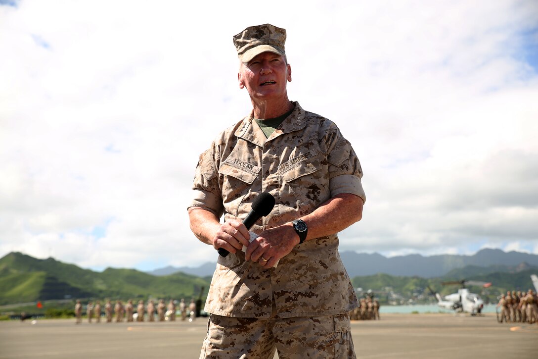 140815-M-LV138-513 MARINE CORPS BASE HAWAII – Lt. Gen. John A. Toolan, commander of U.S. Marine Corps Forces Pacific, speaks to a crowd of visitors during the unit’s Change of Command ceremony Aug. 15, aboard Marine Corps Base Hawaii. Toolan replaced Lt. Gen. Terry Robling, who retired after the ceremony. (U.S. Marine Corps photo by Sgt. Sarah Dietz)