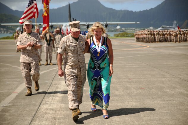 140815-M-LV138-629 MARINE CORPS BASE HAWAII – Lt. Gen. Terry Robling, former commander of Marine Forces Pacific, walks of the parade deck with his wife, Cathe, after receiving awards for his 38 years of service during his retirement ceremony Aug. 15, aboard Marine Corps Base Hawaii. Robling was replaced by Lt. Gen. John A. Toolan. (U.S. Marine Corps photo by Sgt. Sarah Dietz)