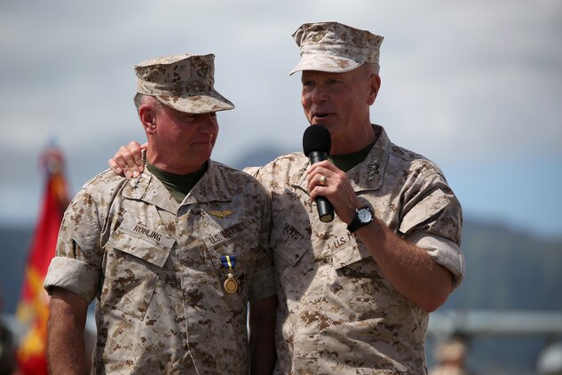 140815-M-LV138-689 MARINE CORPS BASE HAWAII – Gen. James F. Amos, commandant of the Marine Corps (right) speaks about Lt. Gen. Terry Robling, former commander of U.S. Marine Corps Forces, Pacific, during Robling’s retirement ceremony Aug. 15, aboard Marine Corps Base Hawaii. Robling has served 38 years in the Marine Corps. (U.S. Marine Corps photo by Sgt. Sarah Dietz)