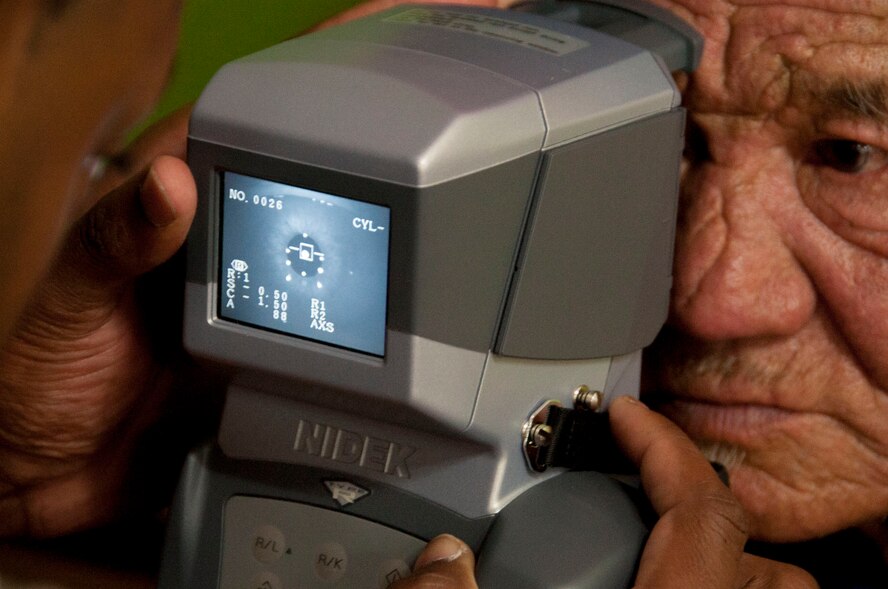 A Mongolian citizen receives an eye exam as part of Pacific Angel 14-4 in Bulgan, Mongolia, Aug. 15, 2014.PACANGEL supports U.S. Pacific Command’s capacity-building efforts by partnering with other governments, non-governmental agencies and multilateral militaries in the respective region to provide medical, dental, optometry, and engineering assistance to their citizens. (U.S. Air Force photo by SSgt. William Banton/Released)