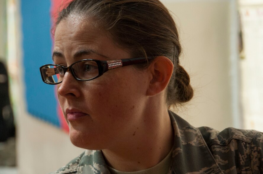 Senior Airman, Danielle Brady, an optometry technician assigned to the 140th Medical Group, Buckley. Colorado, assist’s in a Mongolian citizen’s an eye exam as part of Pacific Angel 14-4 in Bulgan, Mongolia, Aug. 15, 2014. Operation PACANGEL helps cultivate common bonds and foster goodwill between the U.S., Mongolia and regional nations by conducting multilateral humanitarian assistance and civil military operations. (U.S. Air Force photo by Staff Sgt. William Banton/Released)