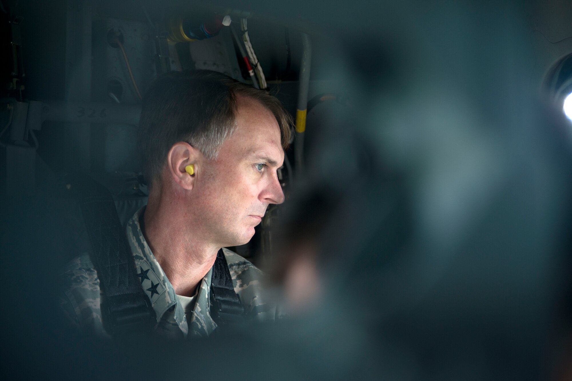 Maj. Gen. Warren Berry, Air Mobility Command director of logistics, observes the Joint Base McGuire-Dix-Lakehurst training grounds on the way to visit Exercise Eagle Flag. The U.S. Air Force Expeditionary Center directs the exercise to test contingency response units’ ability to quickly establish aerial operations, provide security, track cargo and personnel, and move supplies in an immersive scenario. Berry toured Eagle Flag as a part of an orientation tour to see the range of Mobility and Expeditionary education, training, and exercise opportunities available at the EC.  (US Air Force Photo/Master Sgt. Christopher Bergstrom)
