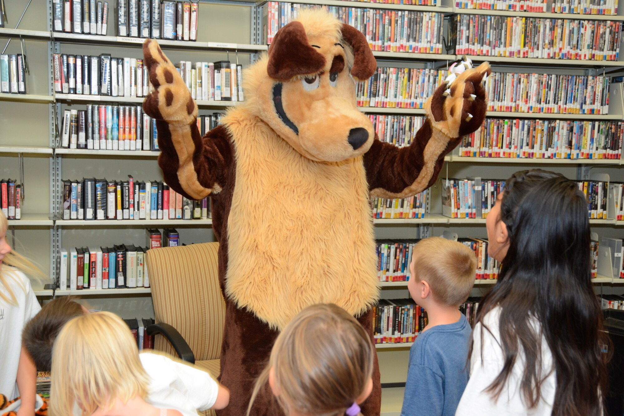 Eddie the Coyote entertains children before the grand finale of this year's summer reading program. (U.S. Air Force photo by Kenji Thuloweit)
