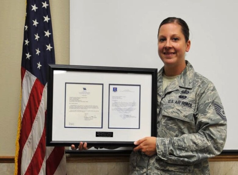 Tech. Sgt. Elizabeth Squires, 319th Contracting Flight contract officer, was awarded the 2014 Airlift/Tanker Association Young Leadership Award Aug. 1, 2014. Individuals are selected for the award by the  air mobility community based on their leadership skills and job performance. (U.S. Air Force photo/Airman 1st Class Bonnie Brewer)