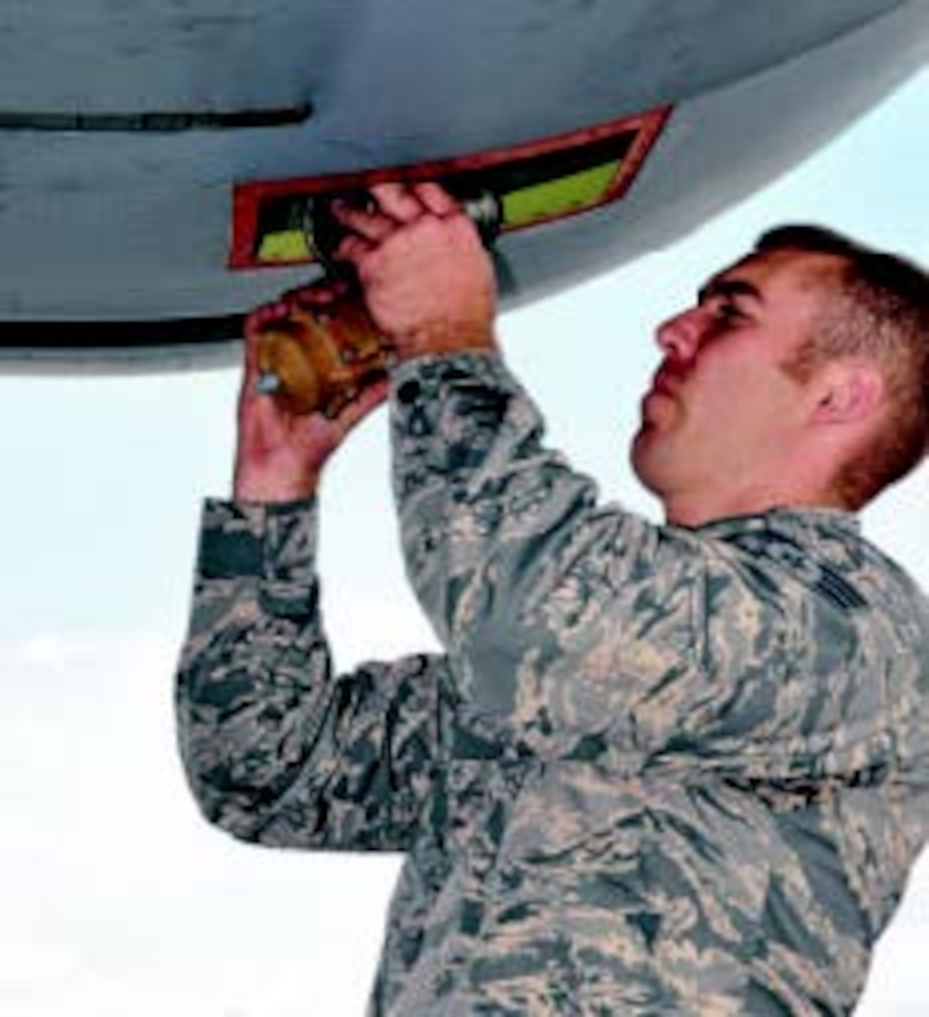 Senior Airman Brandon Fisher, 445 Aircraft Maintenance Squadron electrician, replaces an anti-ice valve in a C-17 Globemaster III during his unit’s annual tour in Germany July 7-21. (Air Force photos by Capt. Elizabeth Caraway)