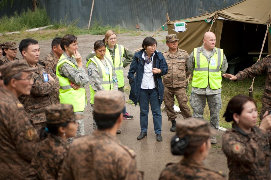 U.S and Mongolian Armed Forces service members gather for a wrap-up meeting during Operation Pacific Angel 14-4 Mongolia, Aug. 8, 2014. Operation PACANGEL helps cultivate common bonds and fosters goodwill between the U.S., Mongolia and regional nations by conducting multilateral humanitarian assistance and civil military operations. (U.S. Air Force photo by Staff Sgt. William Banton/Released)