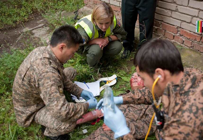 U.S. Air Force Capt. Alexis Beauvais, medical subject-matter expert instructor, proctors members of the Mongolian Armed Forces during a mass-casualty response exercise as part of Operation Pacific Angel 14-4 Mongolia, Aug. 8 2014.  Operation PACANGEL helps cultivate common bonds and fosters goodwill between the U.S., Mongolia and regional nations by conducting multilateral humanitarian assistance and civil military operations. (U.S. Air Force photo by Staff Sgt. William Banton/Released)