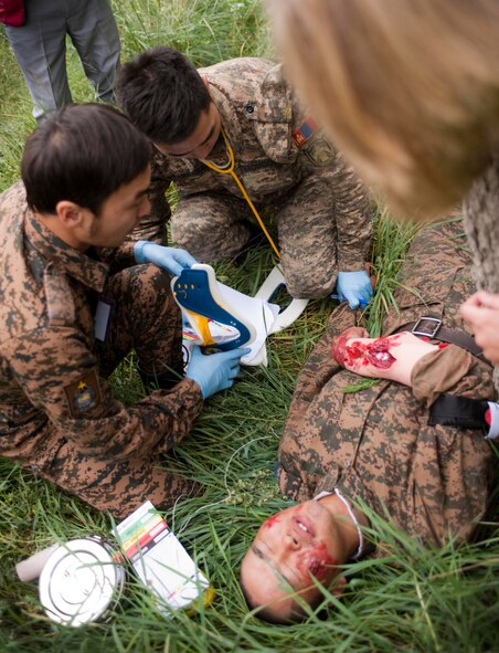 U.S. Air Force Capt. Alexis Beauvais, medical subject-matter expert instructor, proctors members of the Mongolian Armed Forces during a mass-casualty response exercise as part of Operation Pacific Angel 14-4 Mongolia, Aug. 8 2014.  Operation PACANGEL helps cultivate common bonds and fosters goodwill between the U.S., Mongolia and regional nations by conducting multilateral humanitarian assistance and civil military operations. (U.S. Air Force photo by Staff Sgt. William Banton/Released)