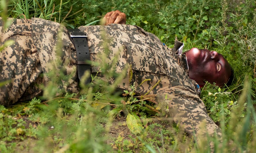 A member of the Mongolian Armed Forces pretends to be a victim during a mass-casualty response exercise during Operation Pacific Angel 14-4 Mongolia, Aug. 8, 2014. Operation PACANGEL helps cultivate common bonds and fosters goodwill between the U.S., Mongolia and regional nations by conducting multilateral humanitarian assistance and civil military operations. (U.S. Air Force photo by Staff Sgt. William Banton/Released)