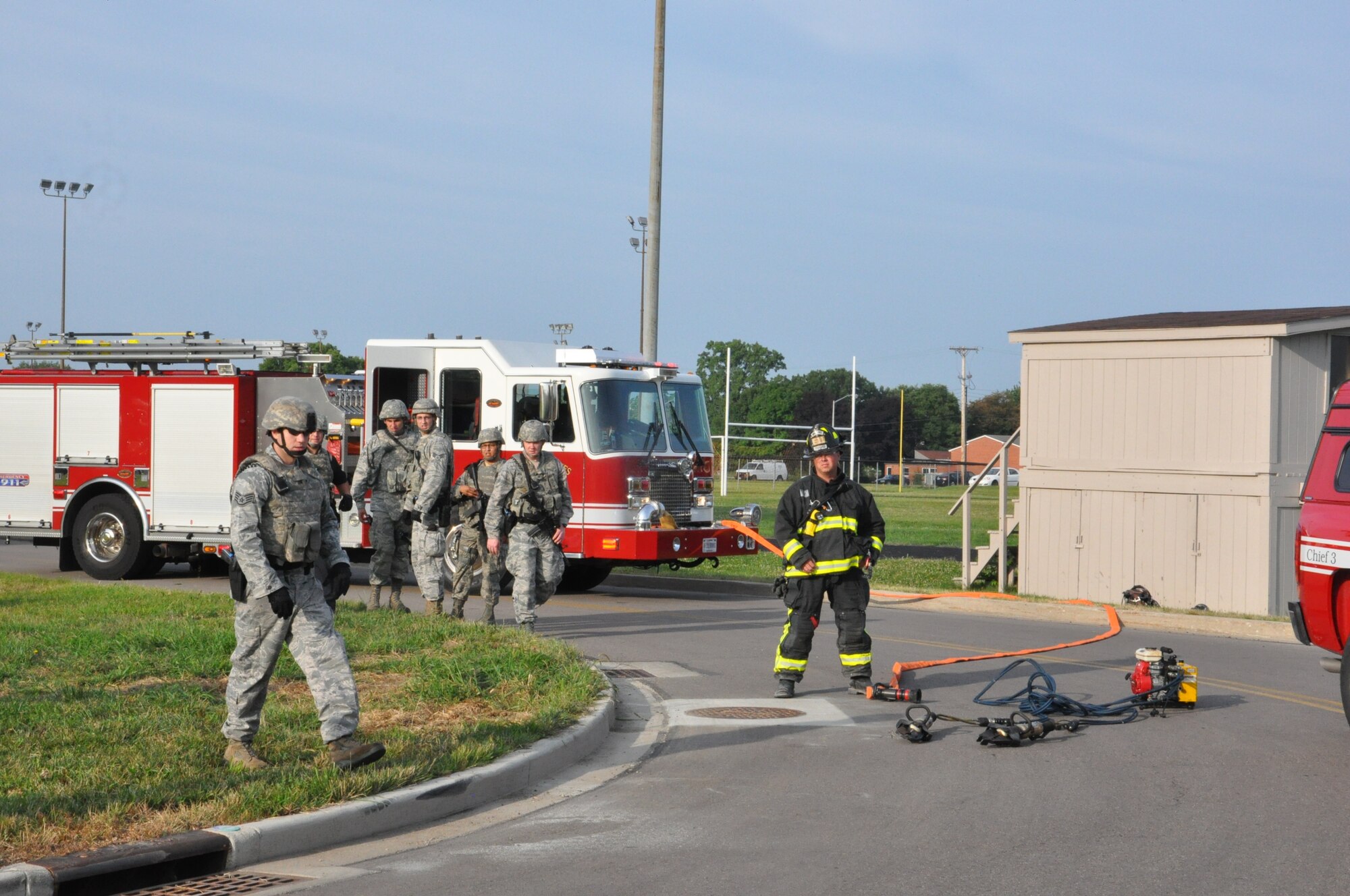 First responders arrive on the scene of a simulated bus accident as part of Excercise Week. (Air Force photo by Diane Kofoed)