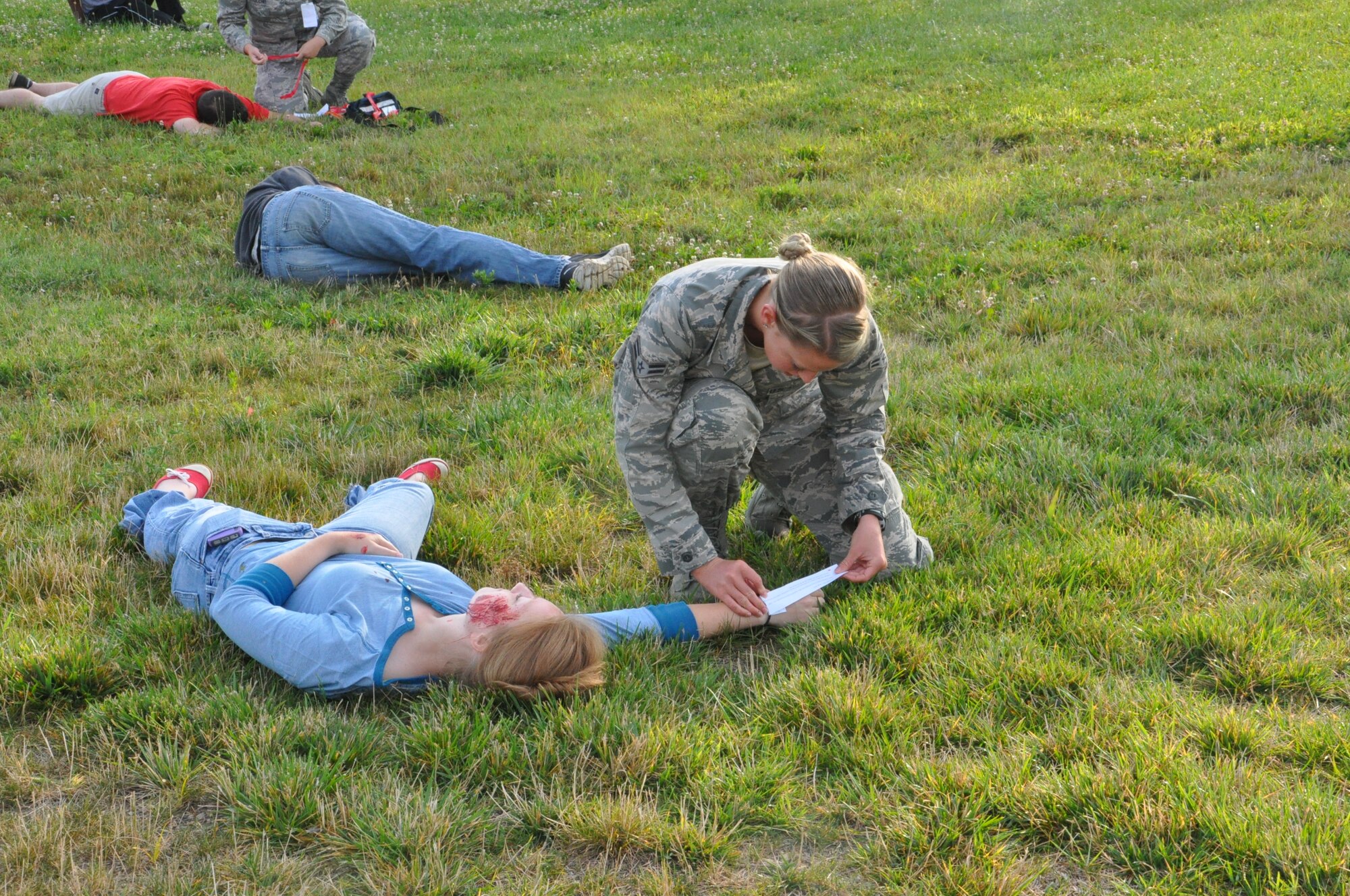 An 88th Medical Group representative cares for a bus victim during a week of exercises at Wright-Patterson Air Force Base. (Air Force photo by Diane Kofoed)
