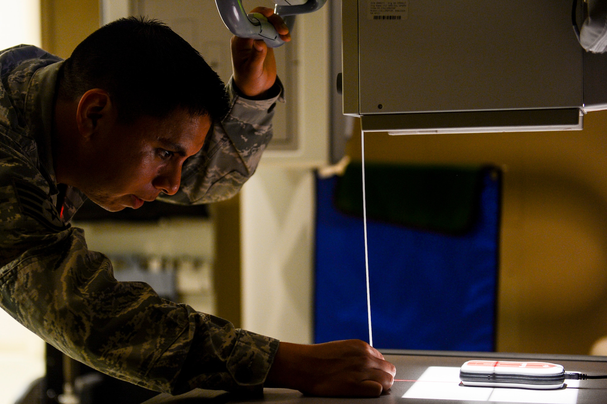 Staff Sgt. Luis Montenegro, 1st Special Operations Medical Support Squadron Biomedical Equipment Technician, preps an X-ray machine for maintenance tests at Hurlburt Field, Fla., Aug. 11, 2014. BMETs from the 1st SOMDSS maintain and repair the equipment used by the 1st Special Operations Medical Group. (U.S. Air Force photo/Airman 1st Class Jeff Parkinson)