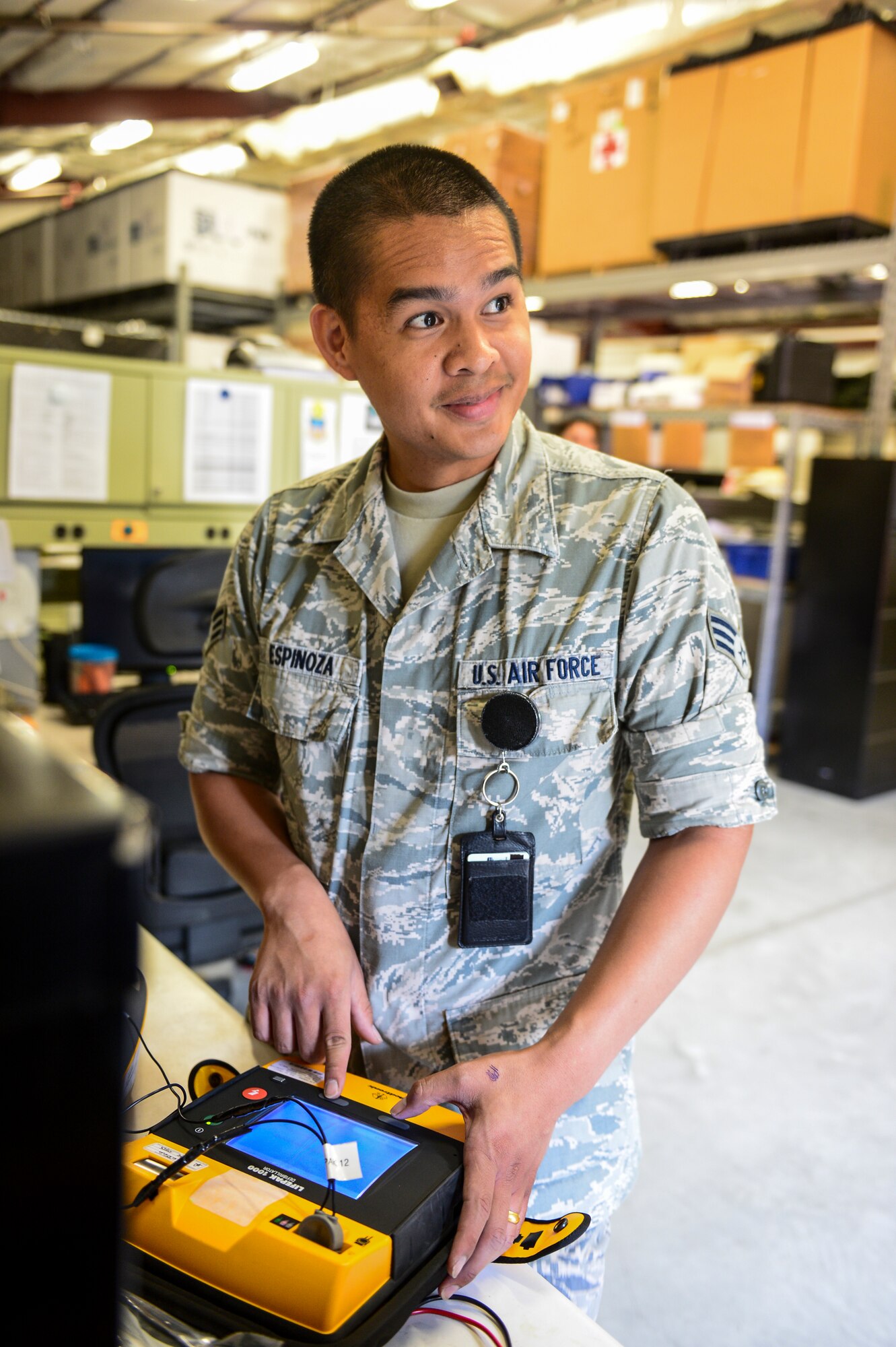 Senior Airman Jason Espinoza, 1st Special Operations Medical Support Squadron biomedical maintenance technician, calibrates an Automatic Electronic Defibrillator at Hurlburt Field, Fla., Aug. 11, 2014. AEDs require routine maintenance to assure they will operate properly in the event of an emergency. (U.S. Air Force photo/Airman 1st Class Jeff Parkinson)