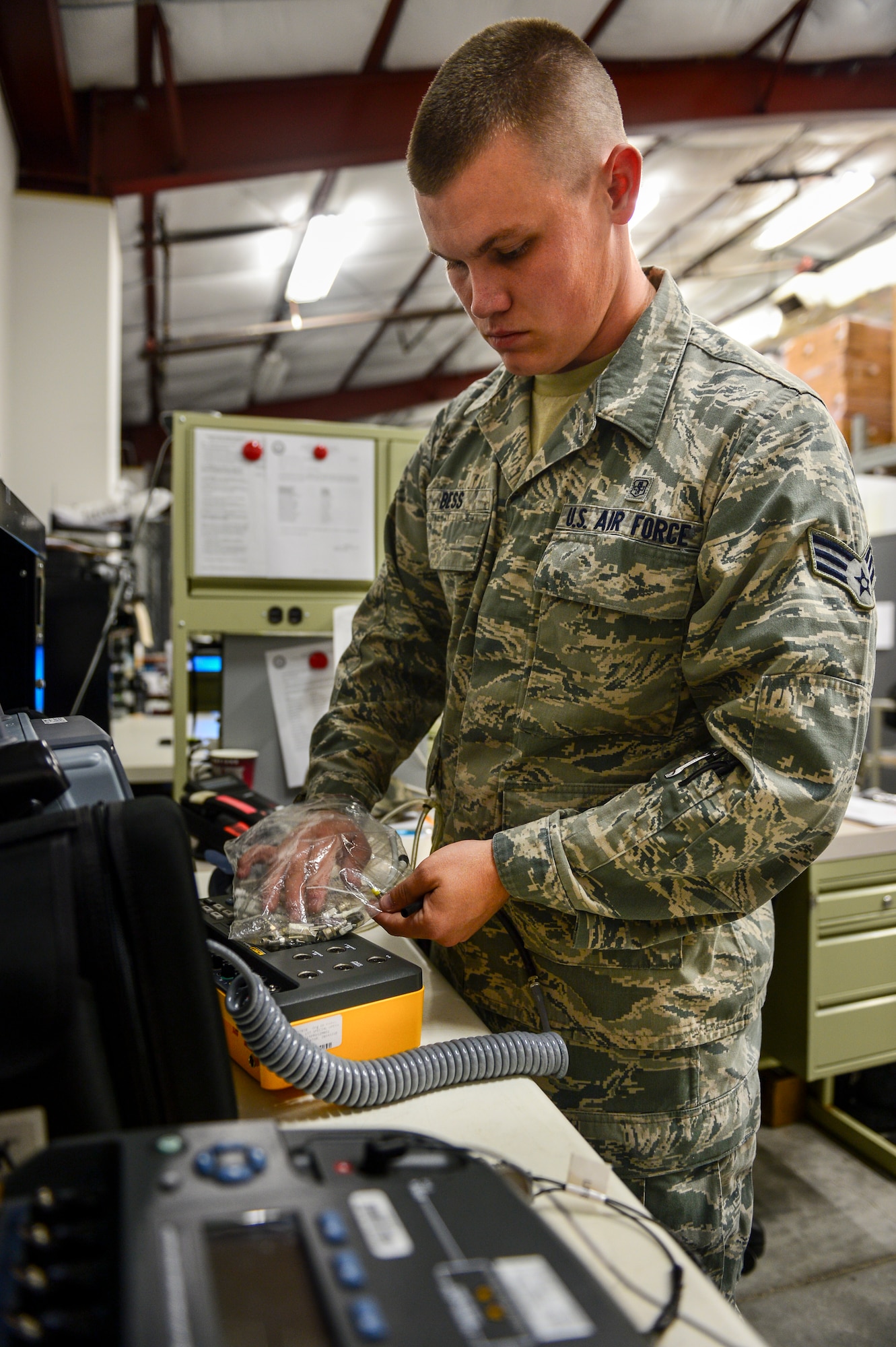 Senior Airman James Bess, 1st Special Operations Medical Support Squadron Biomedical Equipment Technician, repairs a defibrillator at Hurlburt Field, Fla., Aug. 11, 2014. BMETs maintain and repair equipment from blood pressure machines to X-rays machines. (U.S. Air Force photo/Airman 1st Class Jeff Parkinson)