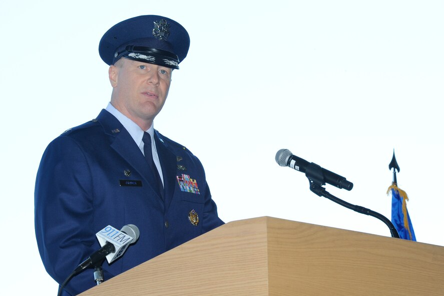 Col. Michael W. Grismer Jr., speaks from the podium after taking command of the 436th Airlift Wing on Aug. 15, 2014, at Dover Air Force Base, Del. Col. Richard G. Moore Jr. relinquished command to Col. Michael W. Grismer Jr. in a ceremony officiated by Lt. Gen. Carlton D. Everhart II. (U.S. Air Force photo/Greg L. Davis) 
