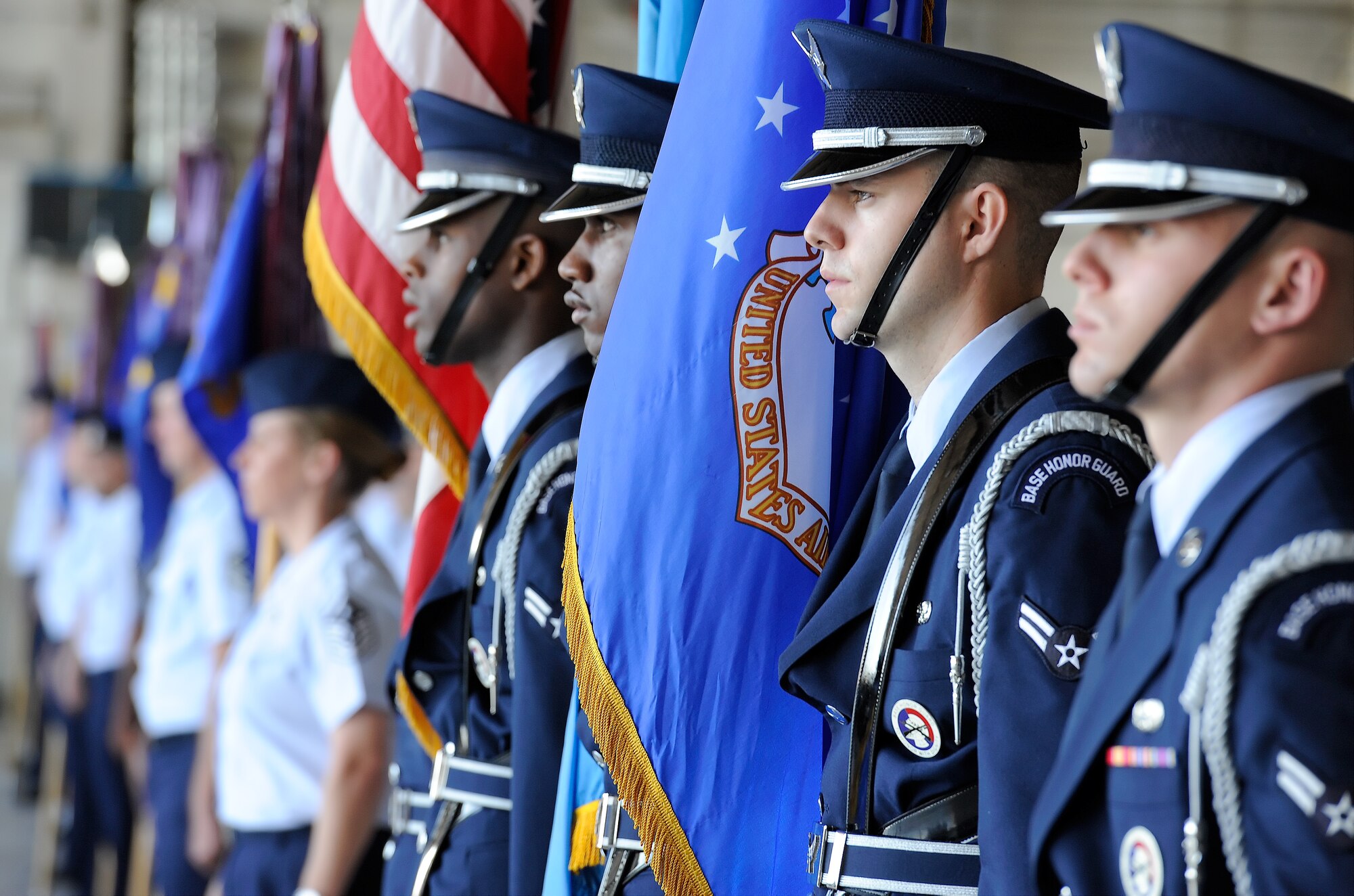 Members of the Dover Air Force Base Honor Guard are joined by Airmen of the 436th Airlift Wing during the Wing Change of Command ceremony on Aug. 15, 2014, at Dover Air Force Base, Del. Col. Richard G. Moore Jr. relinquished command to Col. Michael W. Grismer Jr. in a ceremony officiated by Lt. Gen. Carlton D. Everhart II. (U.S. Air Force photo/Greg L. Davis) 