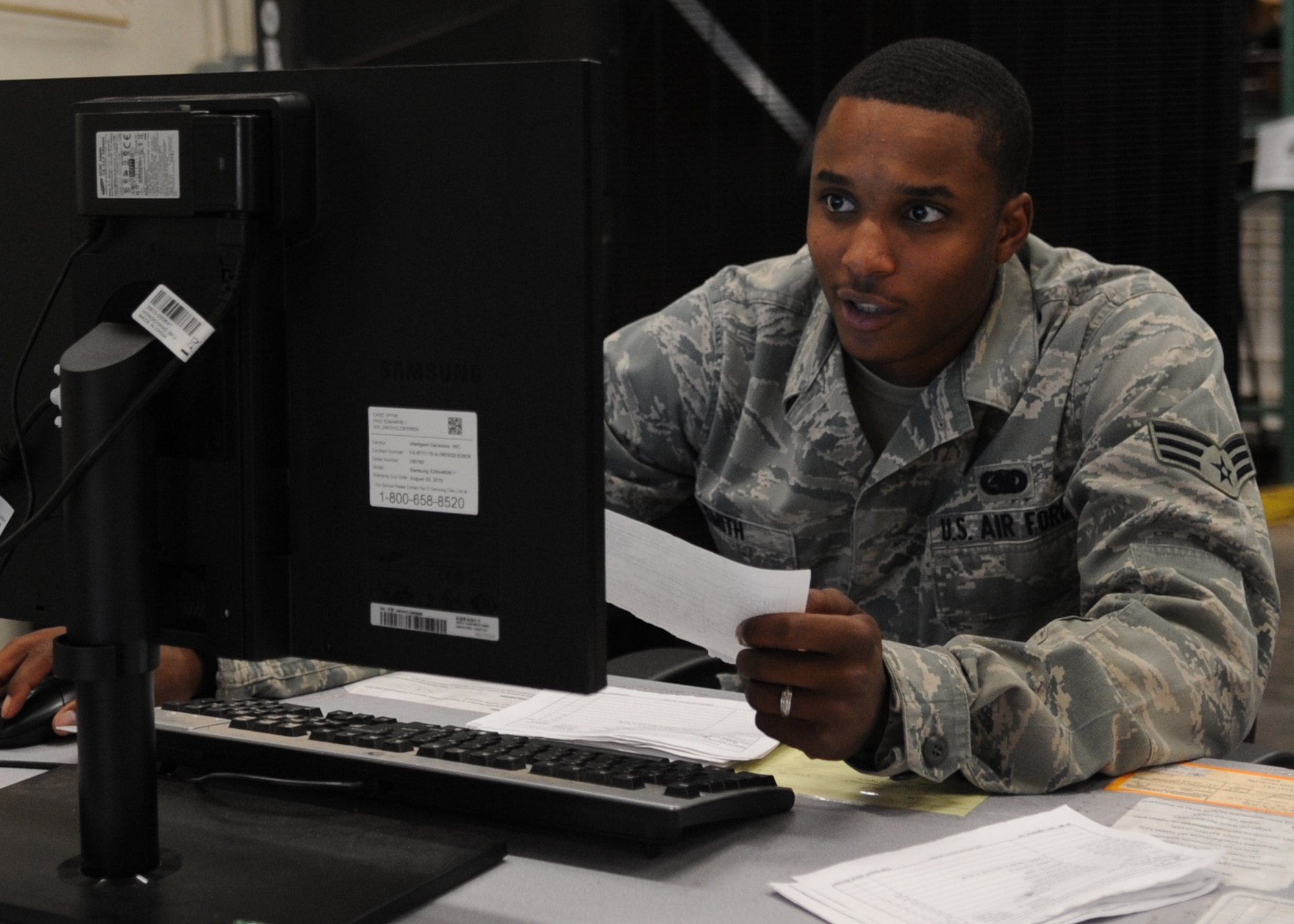 U.S. Air Force Senior Airman Trent Smith, 7th Logistics Readiness Squadron combat mobility journeyman, uses a computer to inventory deployment equipment Aug. 13, 2014, in the combat mobility warehouse at Dyess Air Force Base, Texas. When Airmen are issued gear, their information and the items they received are tracked through the Mobility Inventory Control and Accountability System. (U.S. Air Force photo by Senior Airman Shannon Hall/Released)