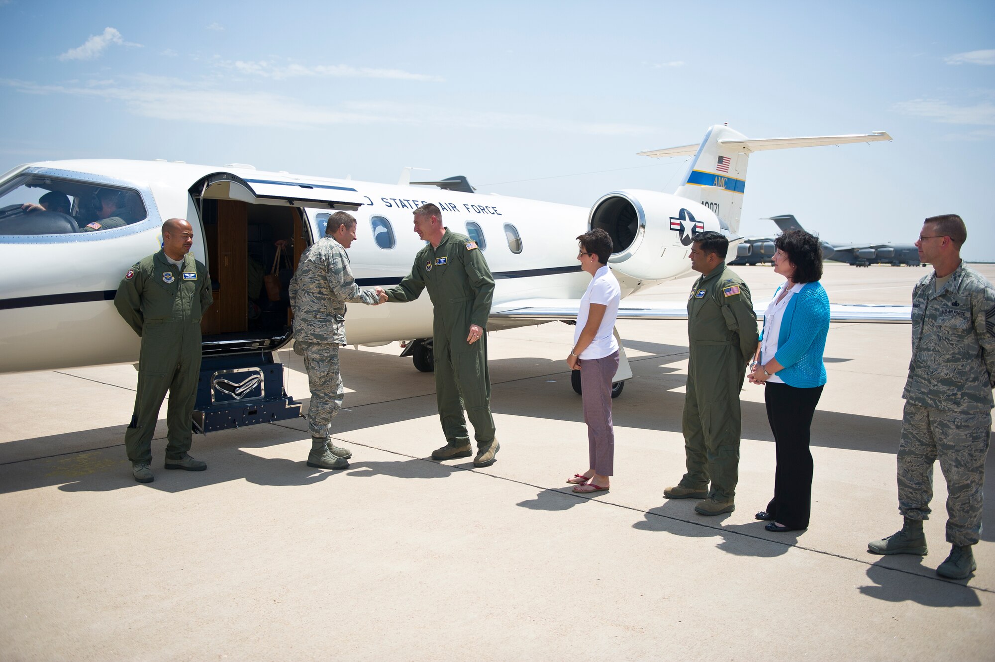 ALTUS AIR FORCE BASE, Okla. – U.S. Air Force Gen. Robin Rand, commander of Air Education and Training Command, is greeted by 97th Air Mobility Wing leaders on the flightline Aug. 6, 2014. Rand visited Altus AFB to meet the Airmen of the Mighty 97th as well as attend the KC-46 Ground Breaking Ceremony. (U.S. Air Force photo by Senior Airman Dillon Davis/Released)