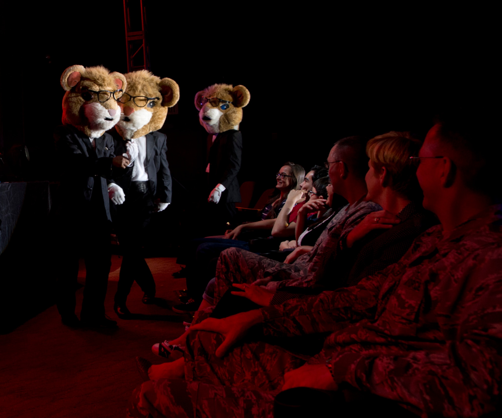 JOINT BASE ELMENDORF-RICHARDSON, Alaska – Some dancing hamsters make their way into the crowd during a Tops In Blue performance at the Talkeetna Theater here Aug. 11. Tops In Blue, is an all-active duty US Air Force special unit made up of talented amateur performers selected for their entertainment abilities. Tops In Blue is one of the oldest and most widely traveled entertainment groups of its kind. Composed of 35 to 40 talented vocalists, musicians, dancers, and technicians, their primary purpose is to perform for military personnel and their families throughout the world. (U.S. Air Force photo/Staff Sgt. Wes Wright)