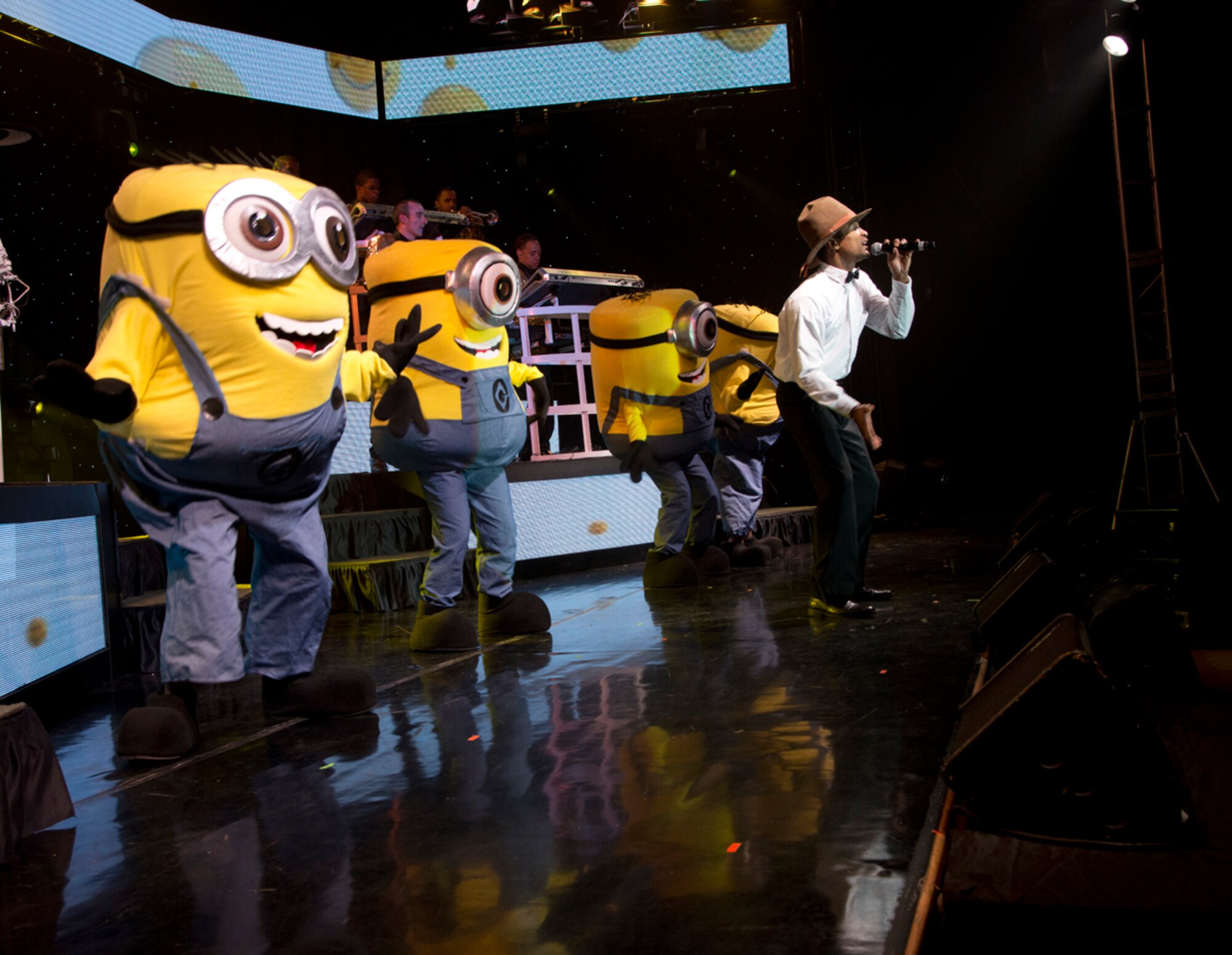 JOINT BASE ELMENDORF-RICHARDSON, Alaska – Senior Airman Charles Cooper, Tops In Blue vocalist, serenades the crowd along with his “minions” during a performance at the Talkeetna Theater here Aug. 11. Tops In Blue, is an all-active duty US Air Force special unit made up of talented amateur performers selected for their entertainment abilities. Tops In Blue is one of the oldest and most widely traveled entertainment groups of its kind. Composed of 35 to 40 talented vocalists, musicians, dancers, and technicians, their primary purpose is to perform for military personnel and their families throughout the world. (U.S. Air Force photo/Staff Sgt. Wes Wright)