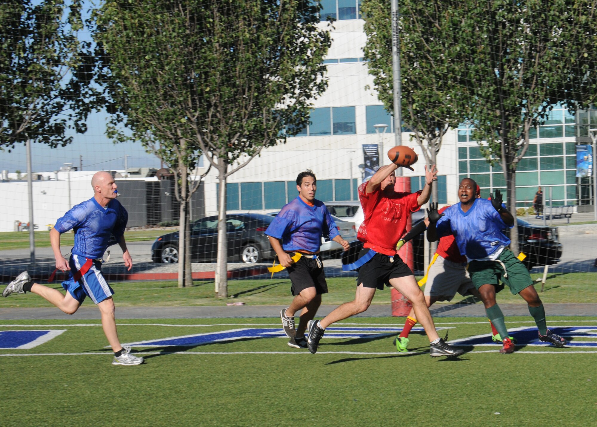 The Space and Missile Systems Center's Remote Sensing Systems directorate's team trounced Aerospace, 41-19, in the Los Angeles Air Force Base, Calif., flag football playoffs for the championship title Aug 14, 2014. (Photos by Joe Juarez) 