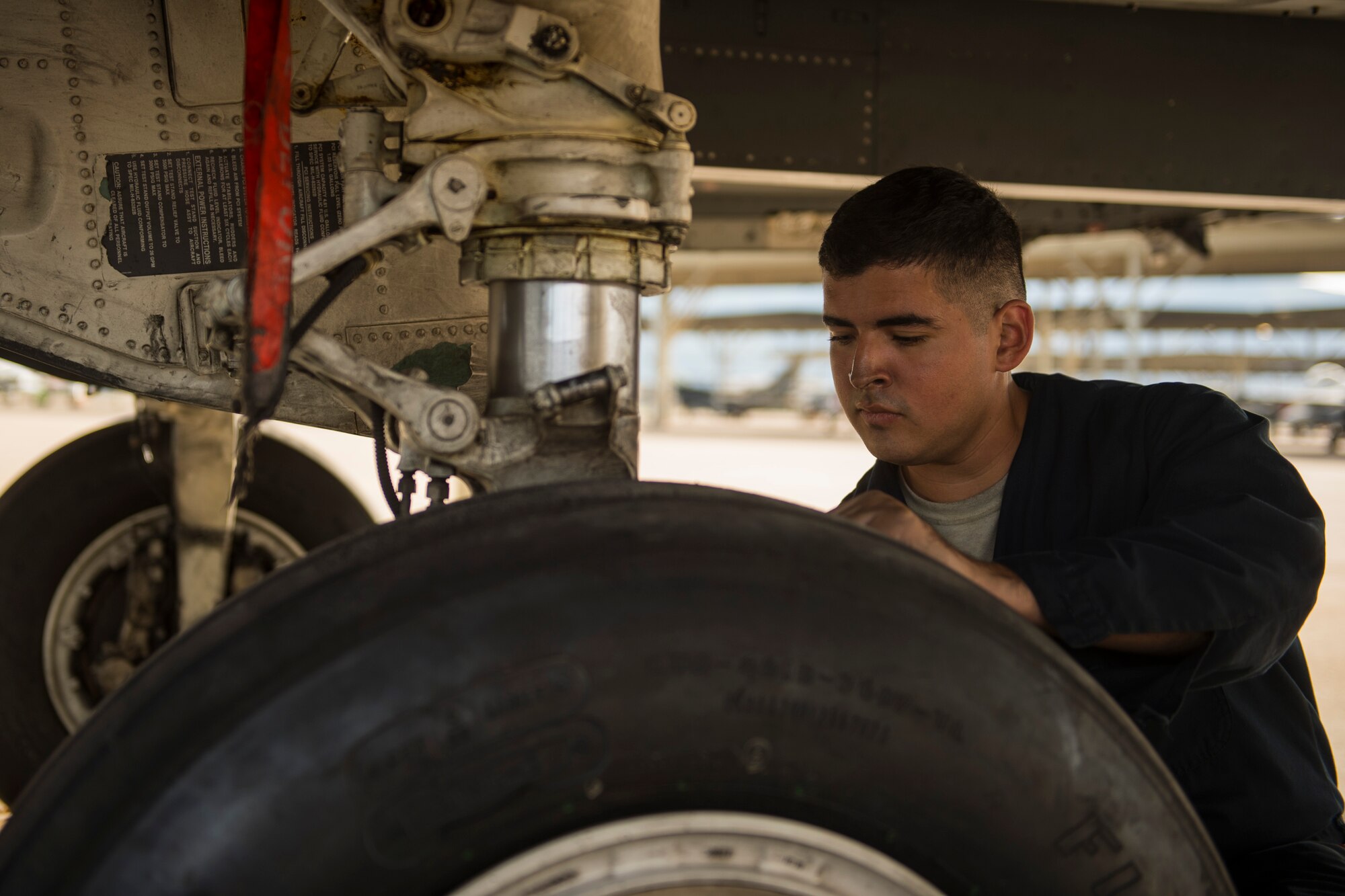 Airman 1st Class Rene Martinez, 494th Fighter Squadron, Royal Air Force Lakenheath, England, prepares an F-15E Strike Eagle for take-off during an air-to-ground Weapons System Evaluation Program(WSEP) at Hill AFB, Utah, Aug. 13, 2014. WSEP is an annual training exercise where the effectiveness, maintainability, suitability and accuracy of guided munitions is evaluated. The 494th FS, as well as the 510th FS from Aviano Air Base, Italy, joined the 388th Fighter Wing of Hill AFB, Utah.(U.S. Air Force photo by Airman 1st Class Taylor Queen/Released)